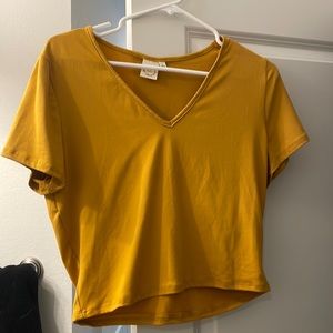 Large mustard yellow soft cropped v-neck. Never worn